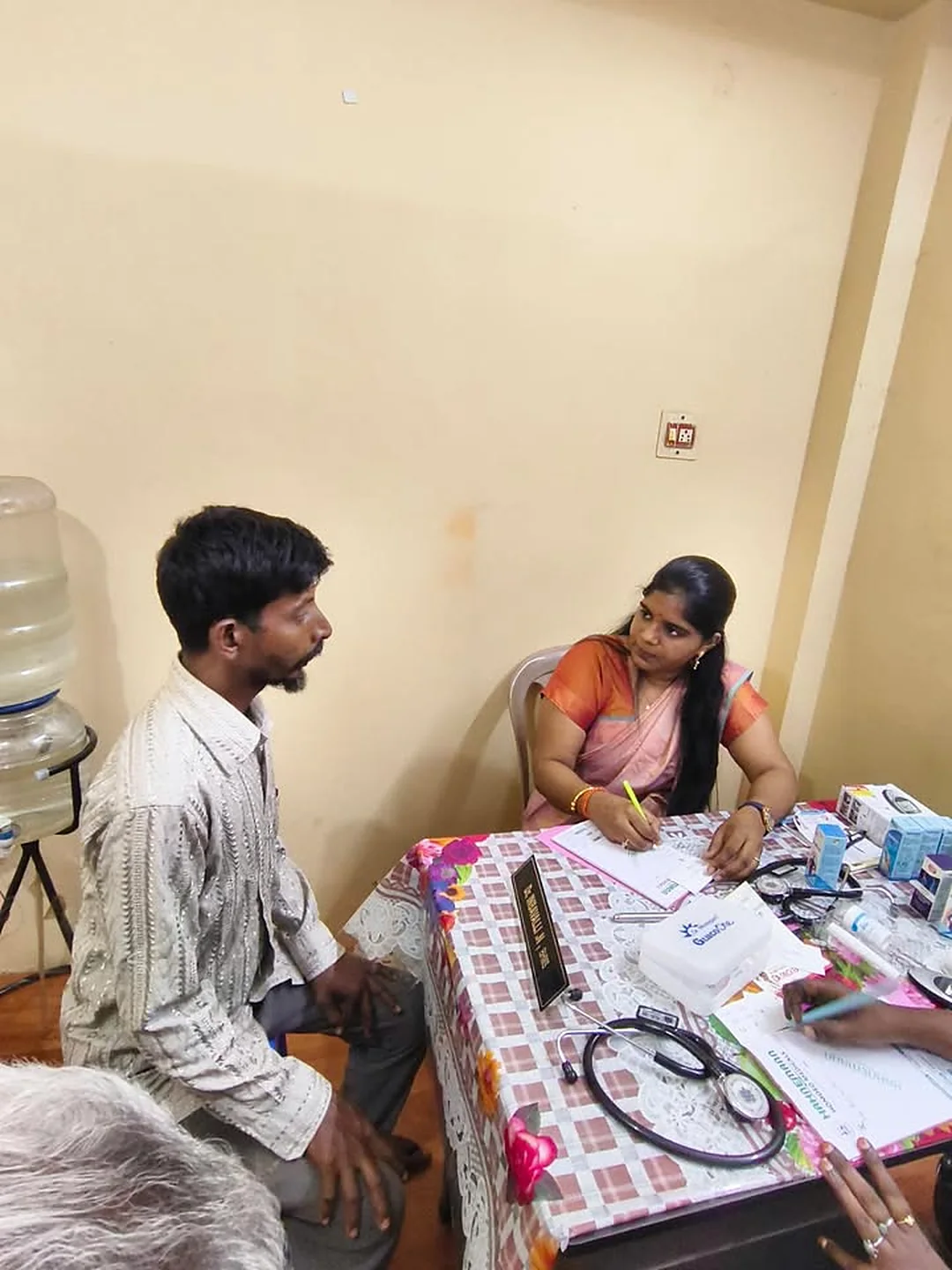 Dr. Inbavalli consulting a patient at a free medical camp