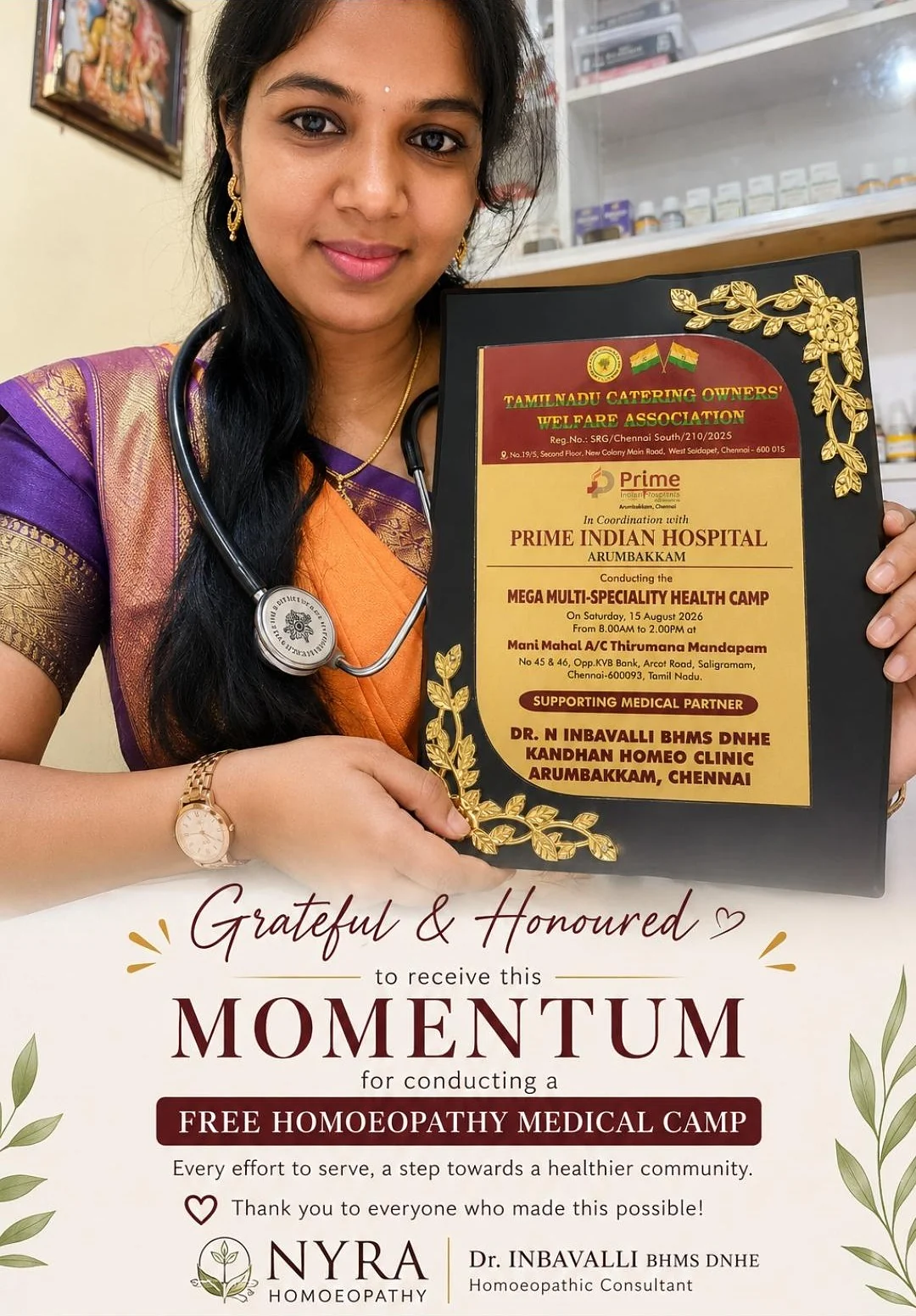 Dr. Inbavalli holding a plaque of appreciation for a free homoeopathy medical camp