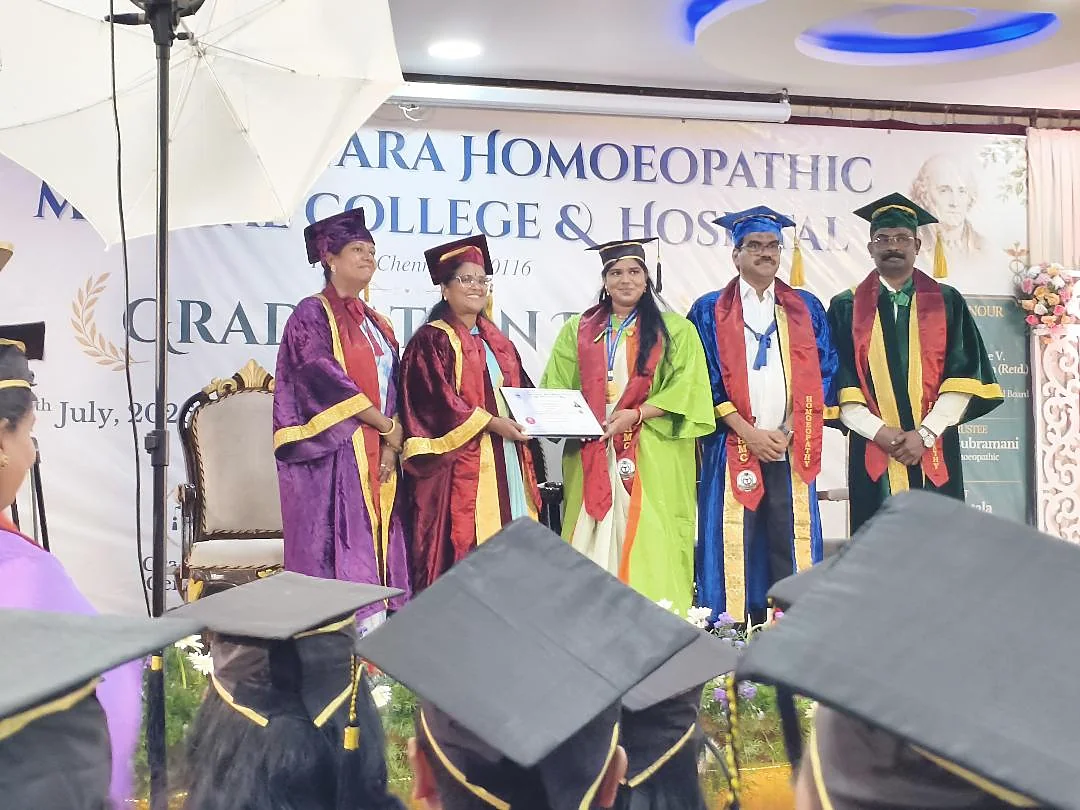 Dr. Inbavalli receiving her certificate on graduation day with faculty members