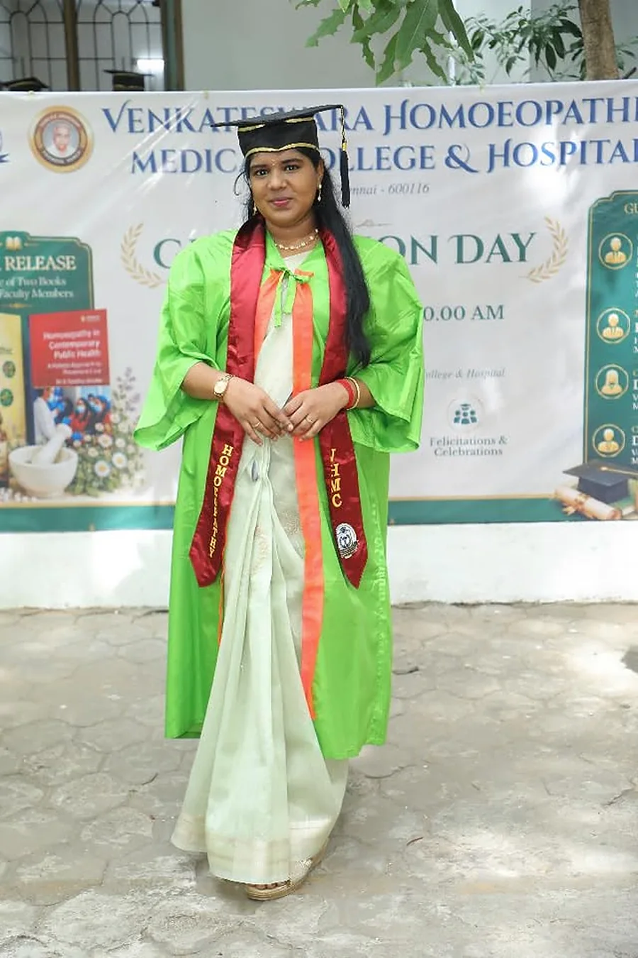 Dr. Inbavalli in graduation robes on graduation day
